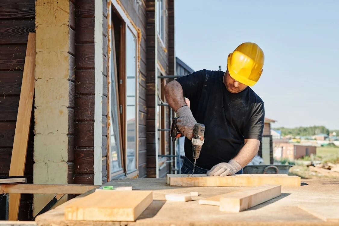 A man building a place to accommodate employees